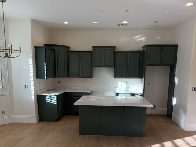 The same kitchen after Happy Brush painted the cabinets